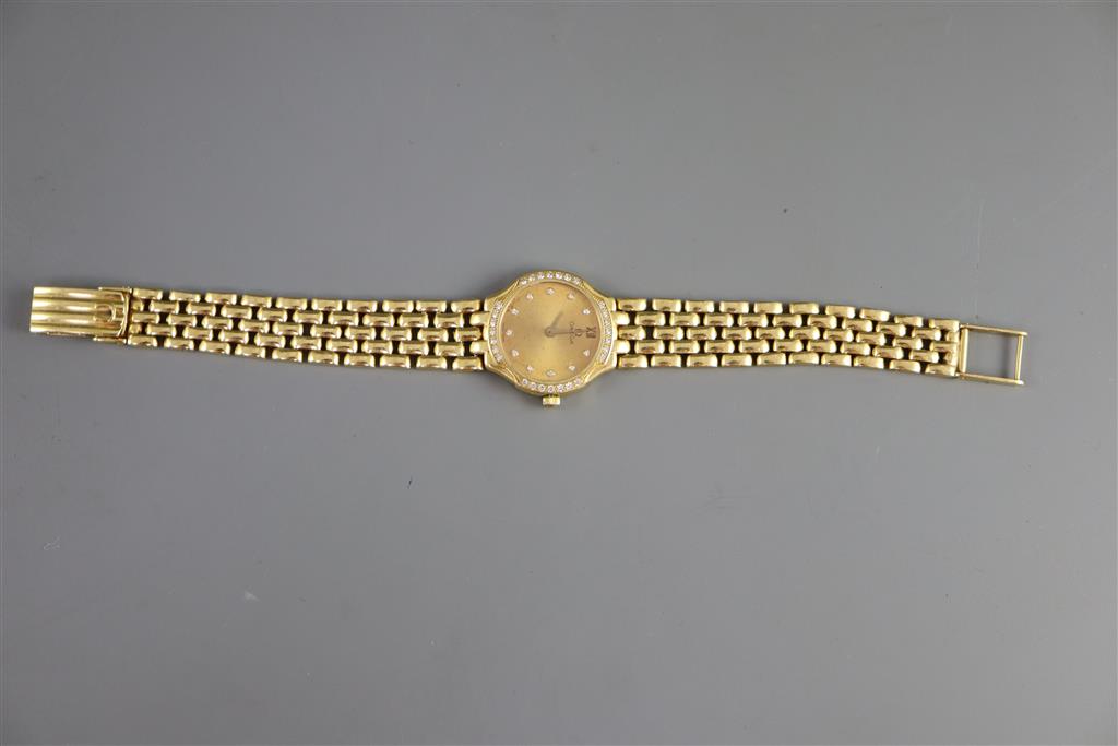 A ladys 18ct. gold Omega quartz wrist watch with diamond set bezel and numerals,